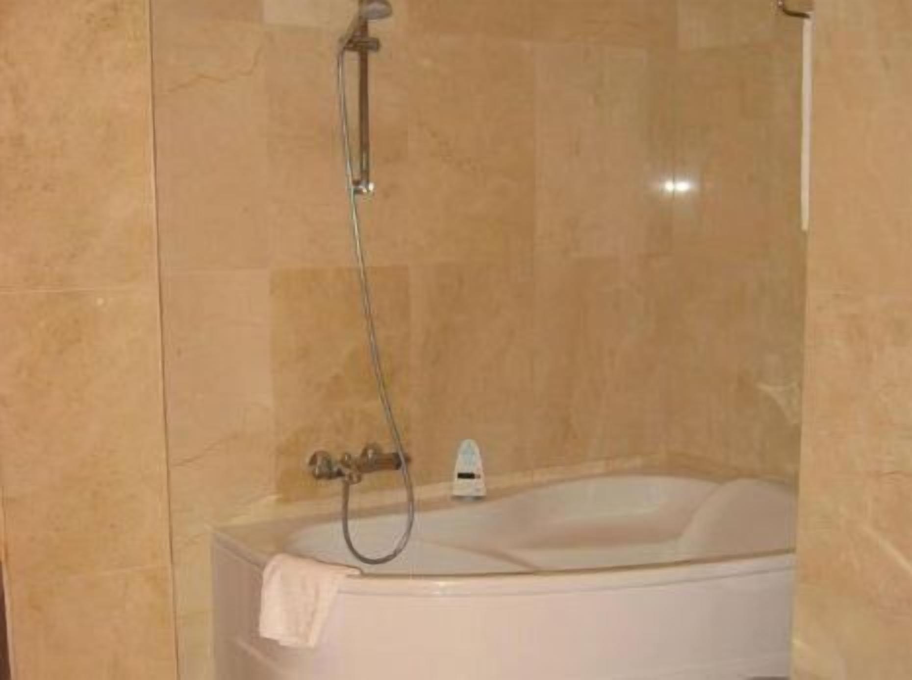 bathtub, free toiletries, hair dryer, towels