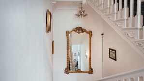 A staircase with ornate white railings and a large ornate mirror. - Metrostays - O'Connell Street 84-1 (Dublin)
