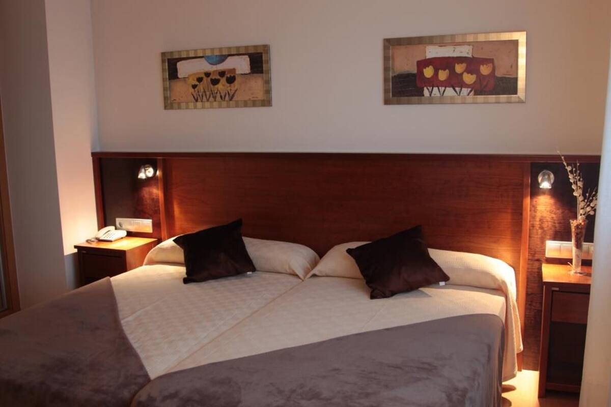 desk, blackout curtains, iron/ironing board, free cots/infant beds