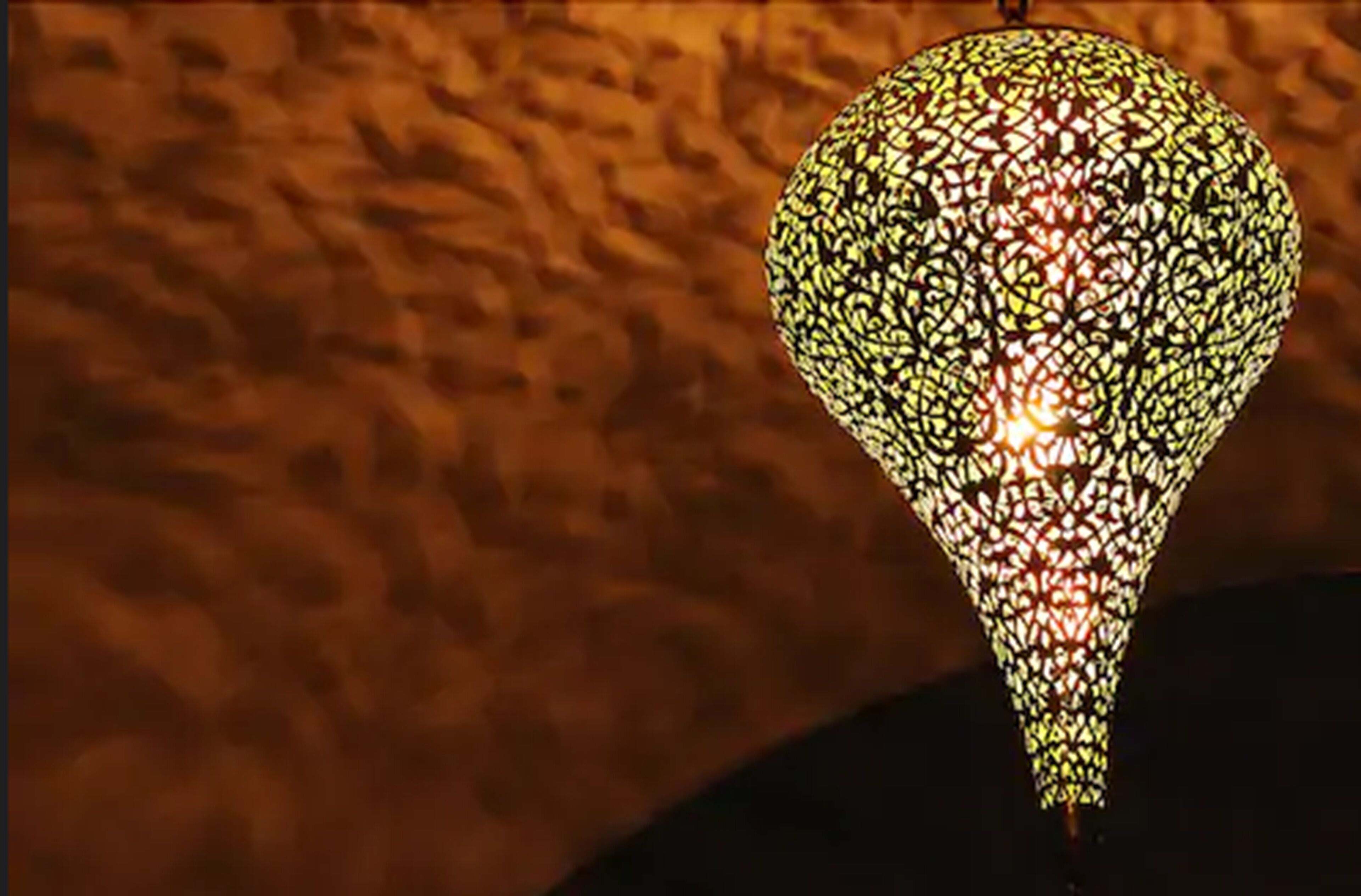A spherical light fixture with a patterned design.
