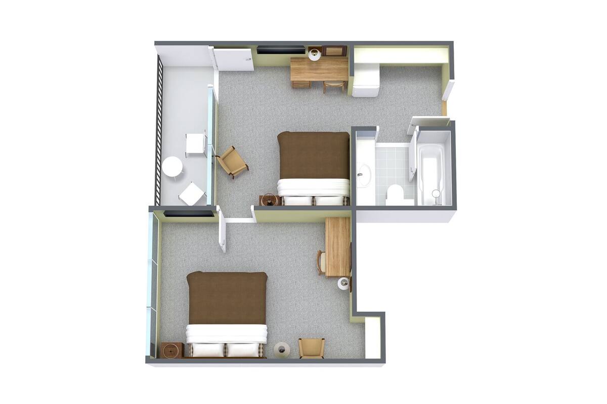 A hotel room layout with a bed, two bedside tables, a desk, a chair, a small table, a sofa, and a bathroom with a toilet and sink.