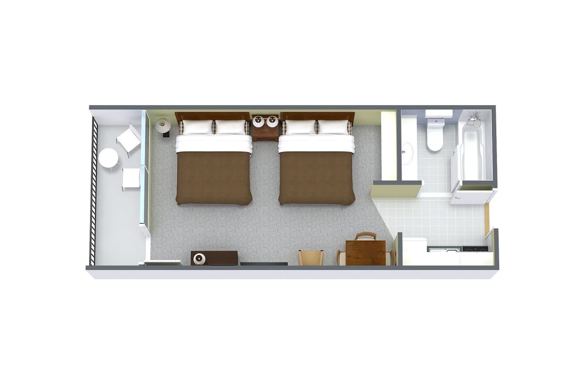 A hotel room layout with two beds, a sitting area, a small table, a sofa, a washbasin, and a toilet.