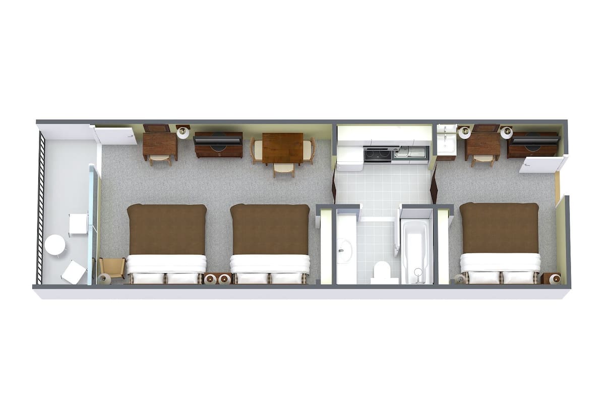 A 2-bedroom suite with a separate bathroom, a kitchenette, and a sitting area.