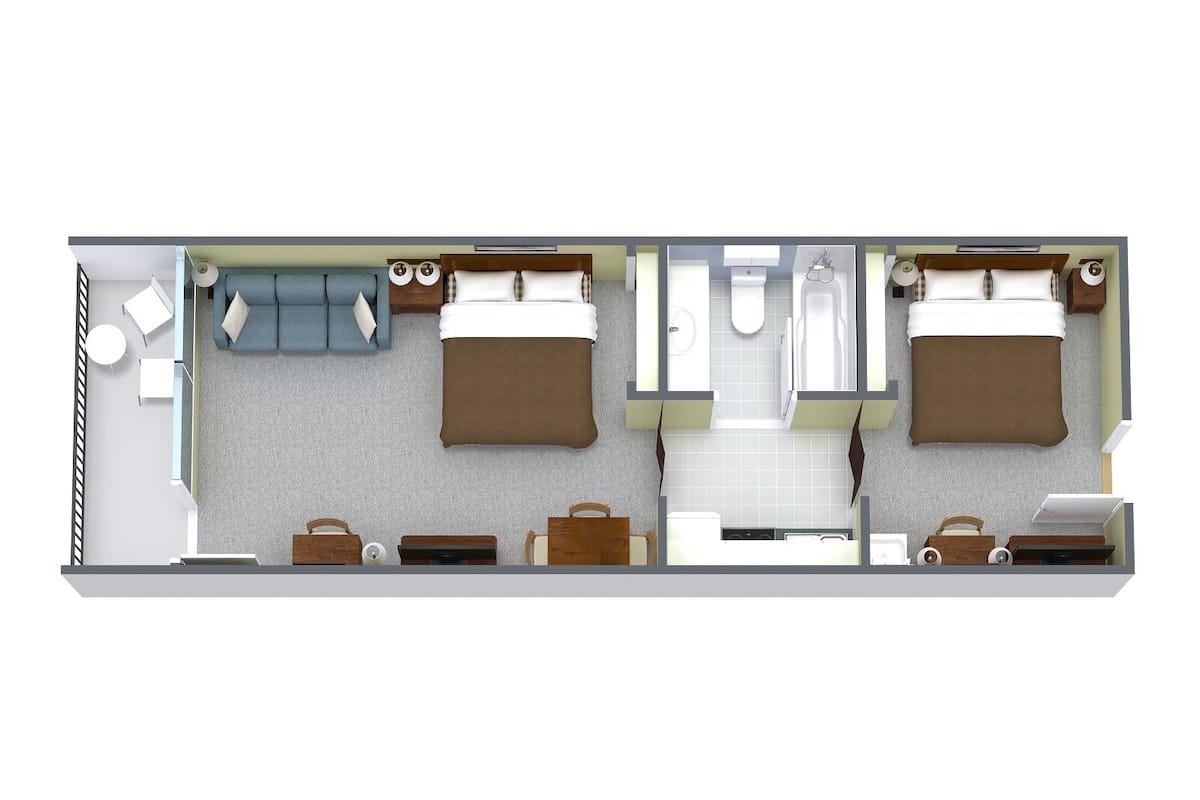 A two-bedroom hotel room layout with a living area, two beds, a bathroom, and a kitchenette.