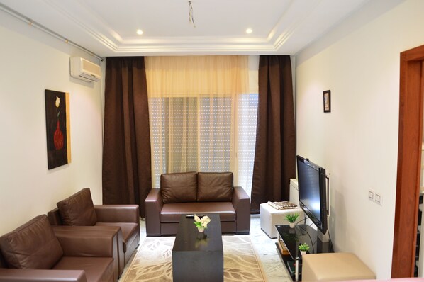 Lägenhet - 2 sovrum | Vardagsrum | Platt-tv