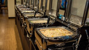 A buffet line with multiple self-service food stations. - The LD Pattaya (Pattaya)