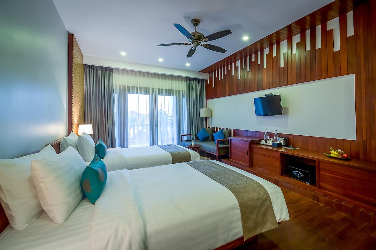 Deluxe Twin Room, 1 Bedroom, Pool View | Minibar, in-room safe, desk, soundproofing