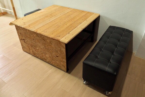A wooden table with a bench.