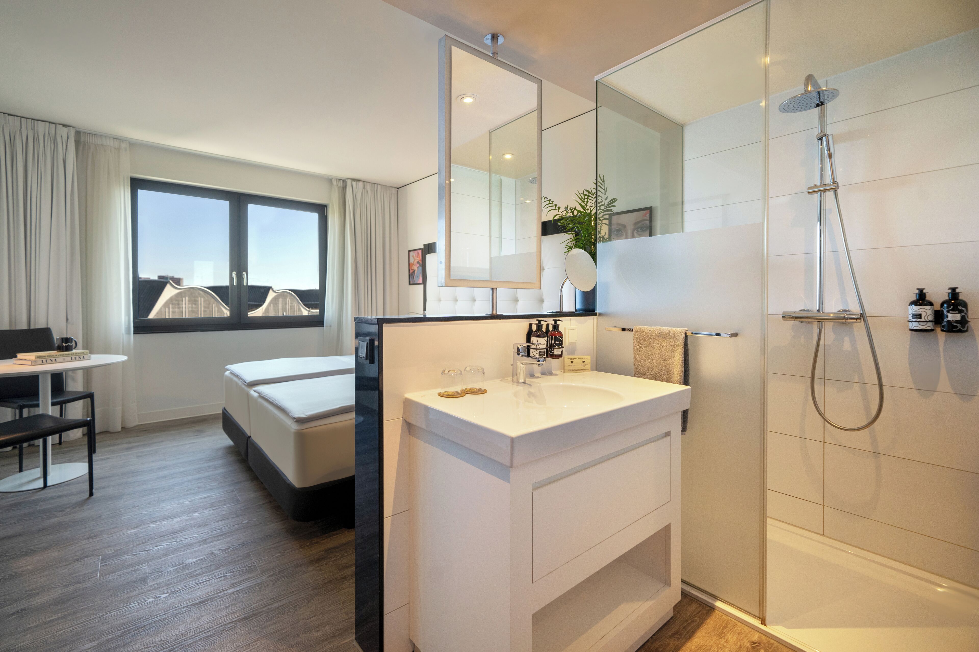 the innside premium room | bathroom | shower, rainfall showerhead, eco-friendly toiletries, hair dryer
