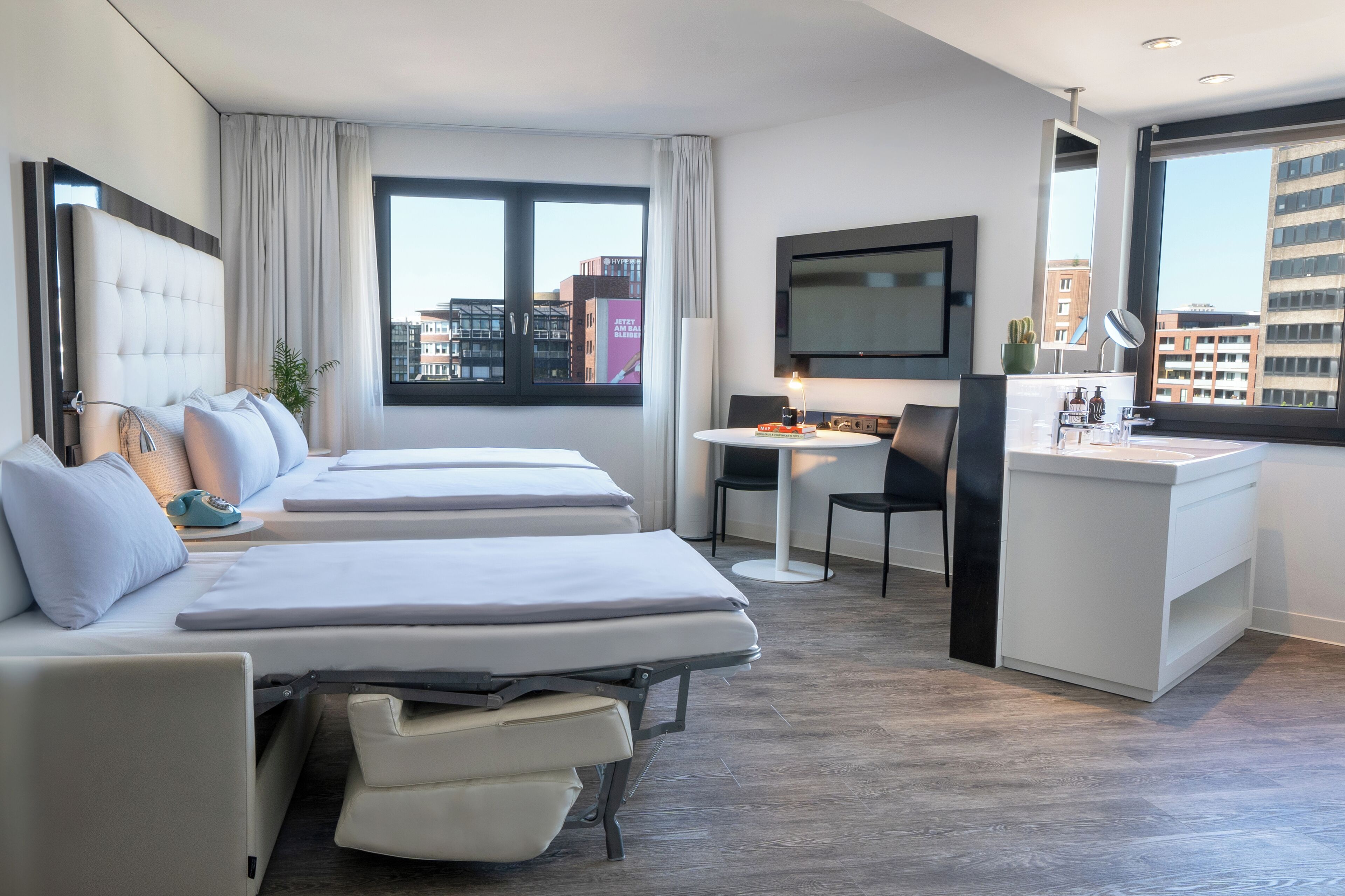 the innside room for families | free minibar, in-room safe, desk, laptop workspace