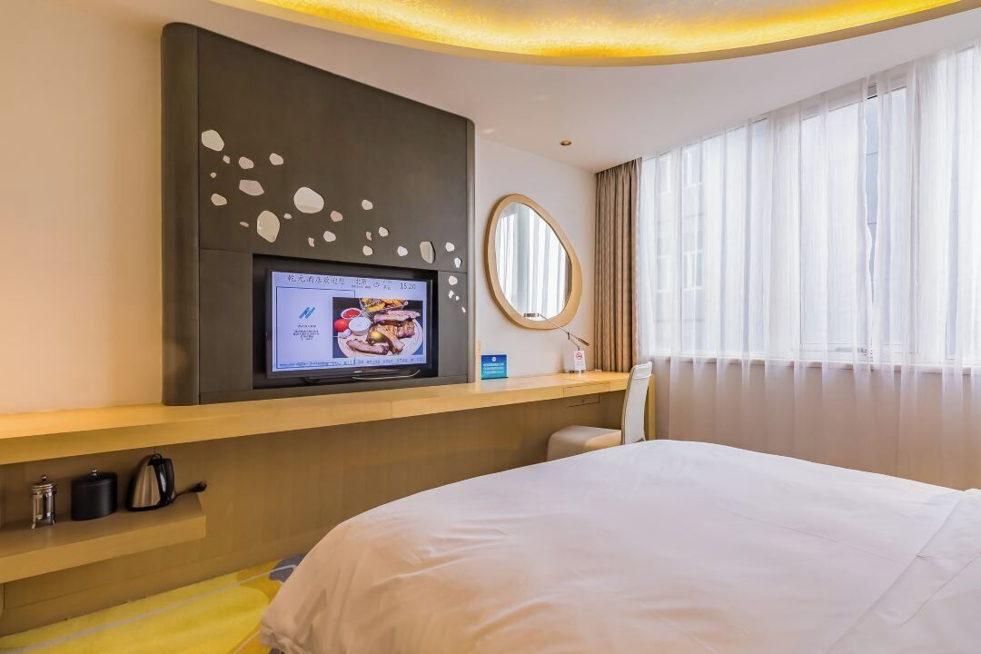 cosmic comfort room  | minibar, in-room safe, desk, blackout curtains