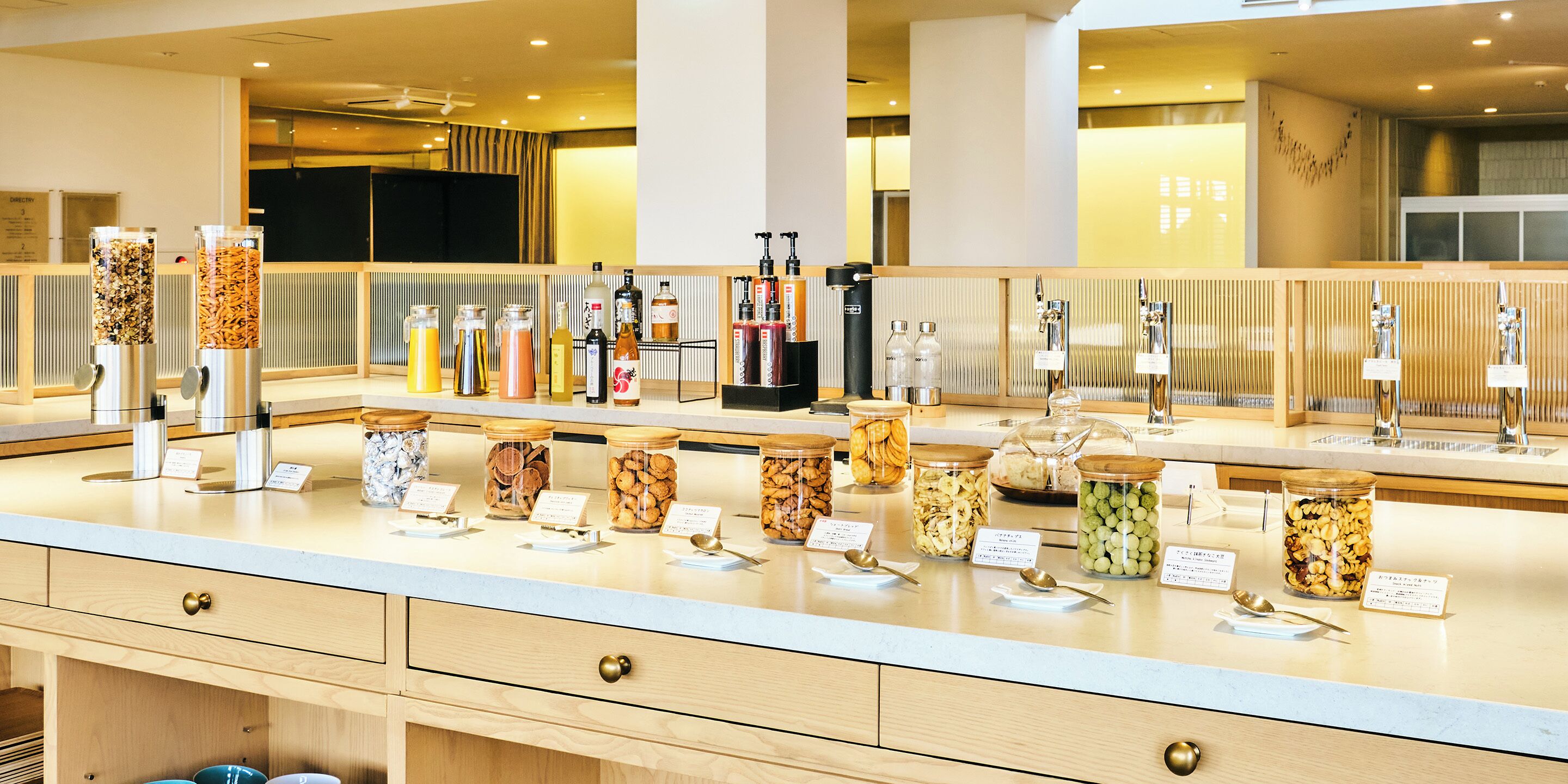 A buffet area with various food items and condiments.