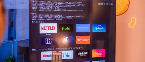 A television screen displaying various streaming service logos.