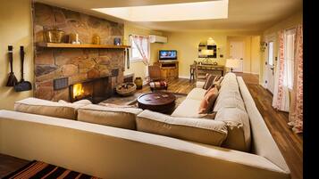 Deluxe Bungalow, 2 Bedrooms, Fireplace | Living area | 32-inch LCD TV with cable channels, TV