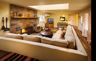 Deluxe Bungalow, 2 Bedrooms, Fireplace | Living area | 32-inch LCD TV with cable channels, TV