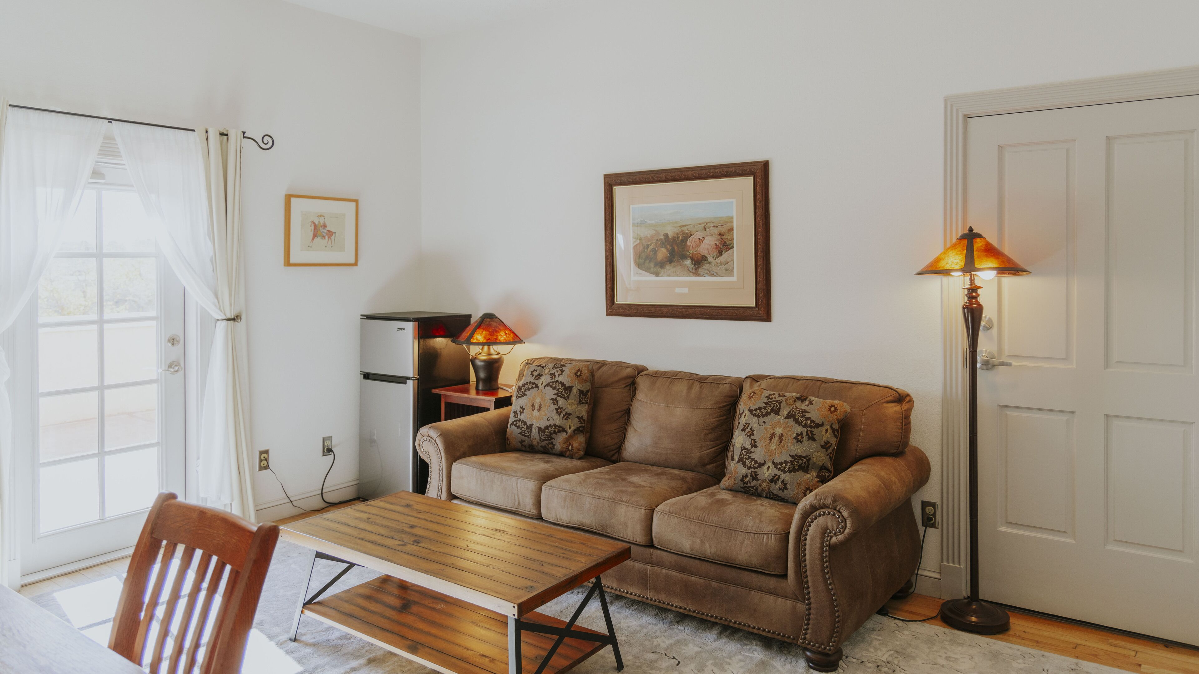 deluxe suite, 1 king bed with sofa bed, balcony (ted turner suite) | living area | 32-inch lcd tv with cable channels, tv