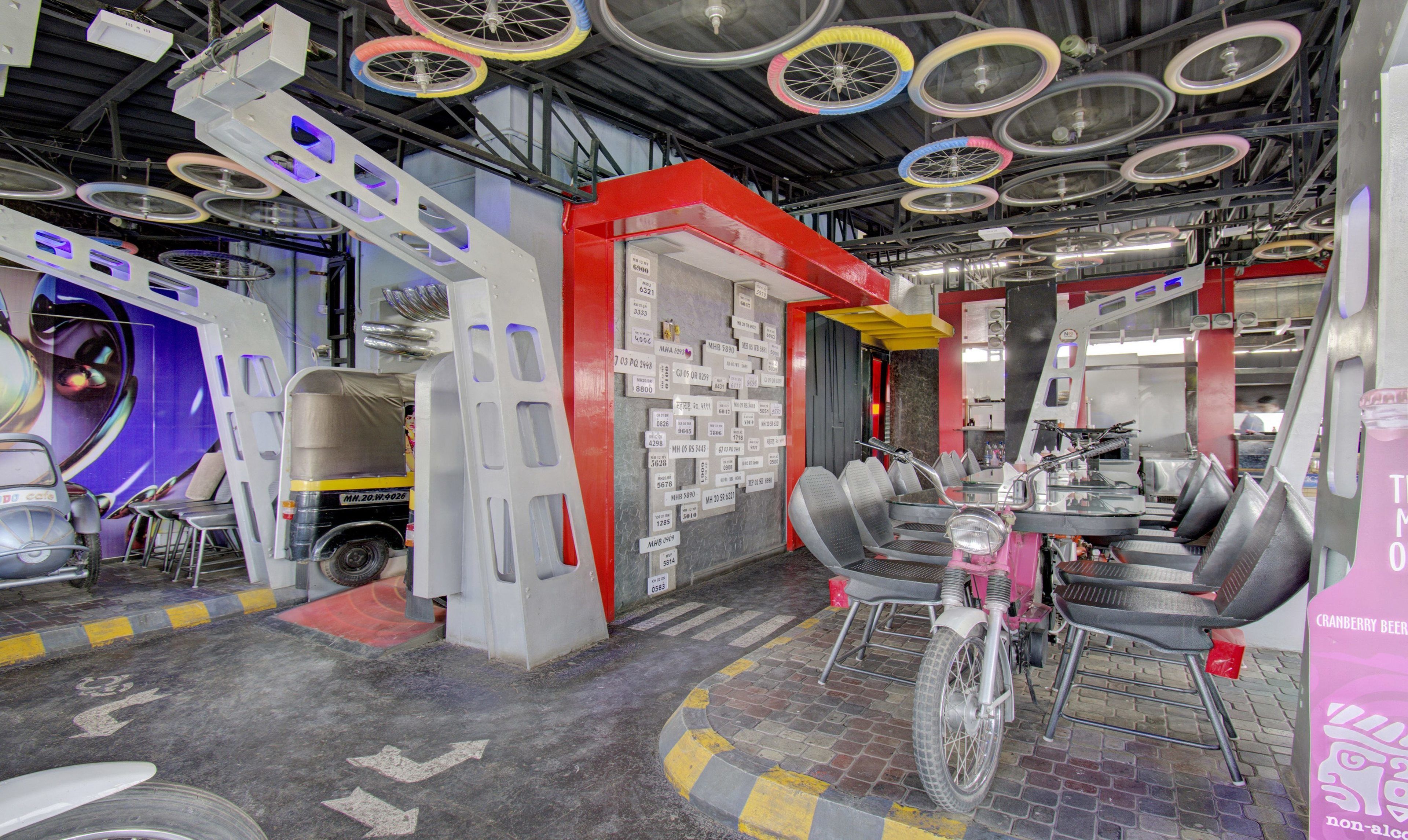 A modern interior with a central table, chairs, and a bicycle.