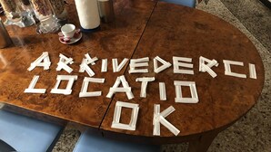 A conference table with a message spelled out in tape.