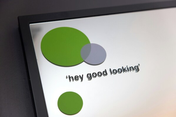A digital display with overlapping circles and the text 'hey good looking'.