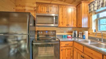 Fridge, microwave, coffee/tea maker, cookware/dishes/utensils