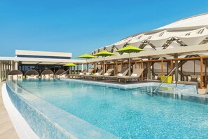 Outdoor pool, open 7:00 AM to 11:00 PM, pool cabanas (surcharge)