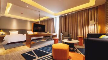 Suite, 1 King Bed, Balcony | In-room safe, desk, soundproofing, iron/ironing board