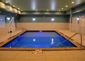 An indoor swimming pool with a shallow water depth of 3 feet and 9 inches, no diving allowed.