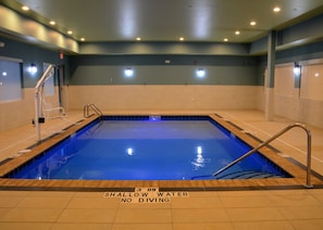 An indoor swimming pool with a shallow water depth of 3 feet and 9 inches, no diving allowed.