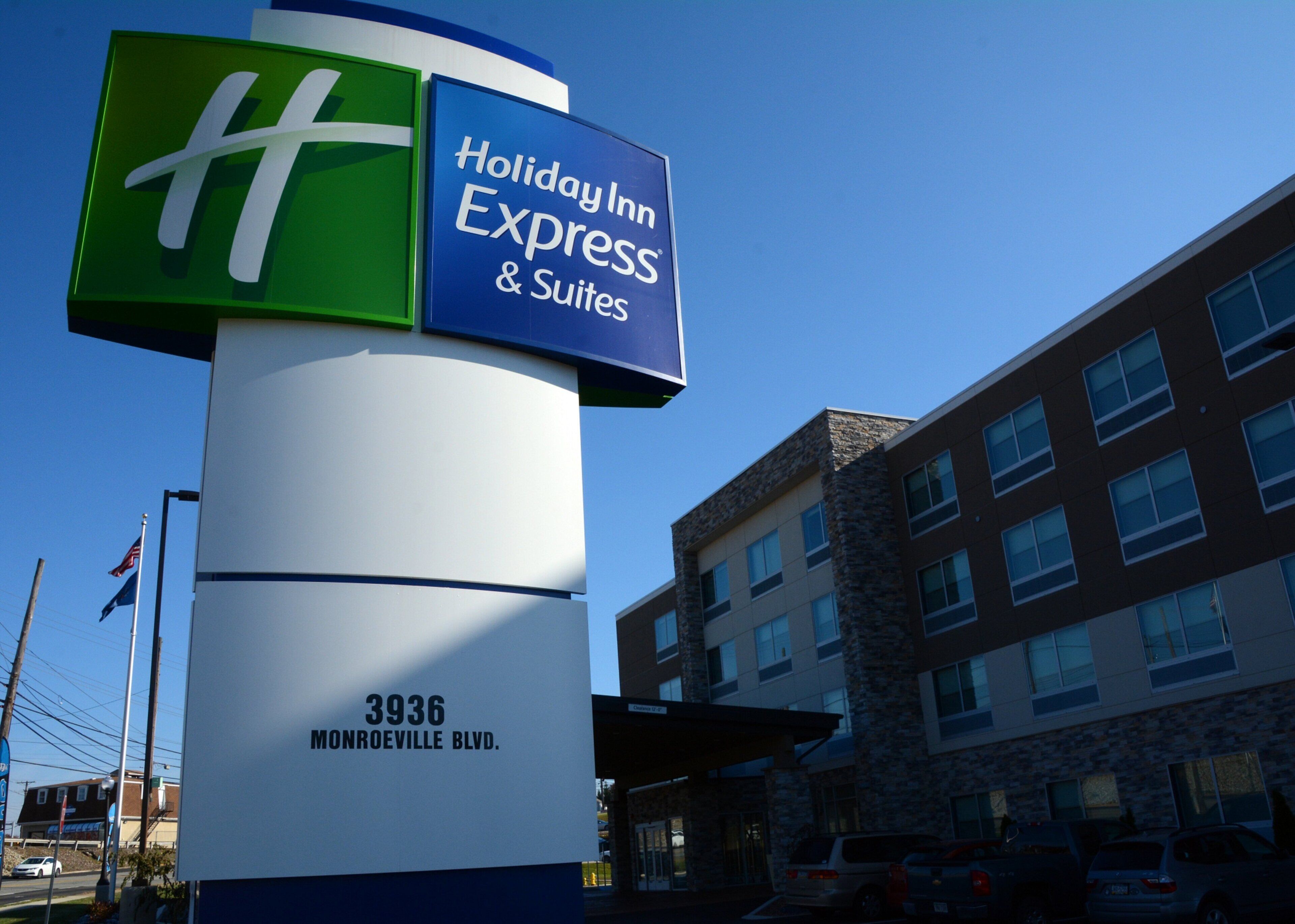A Holiday Inn Express & Suites sign with the address 3936 Monroeville Blvd.