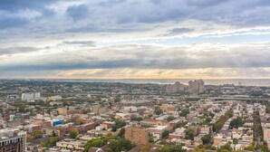 A cityscape with a variety of buildings, including both residential and commercial structures.