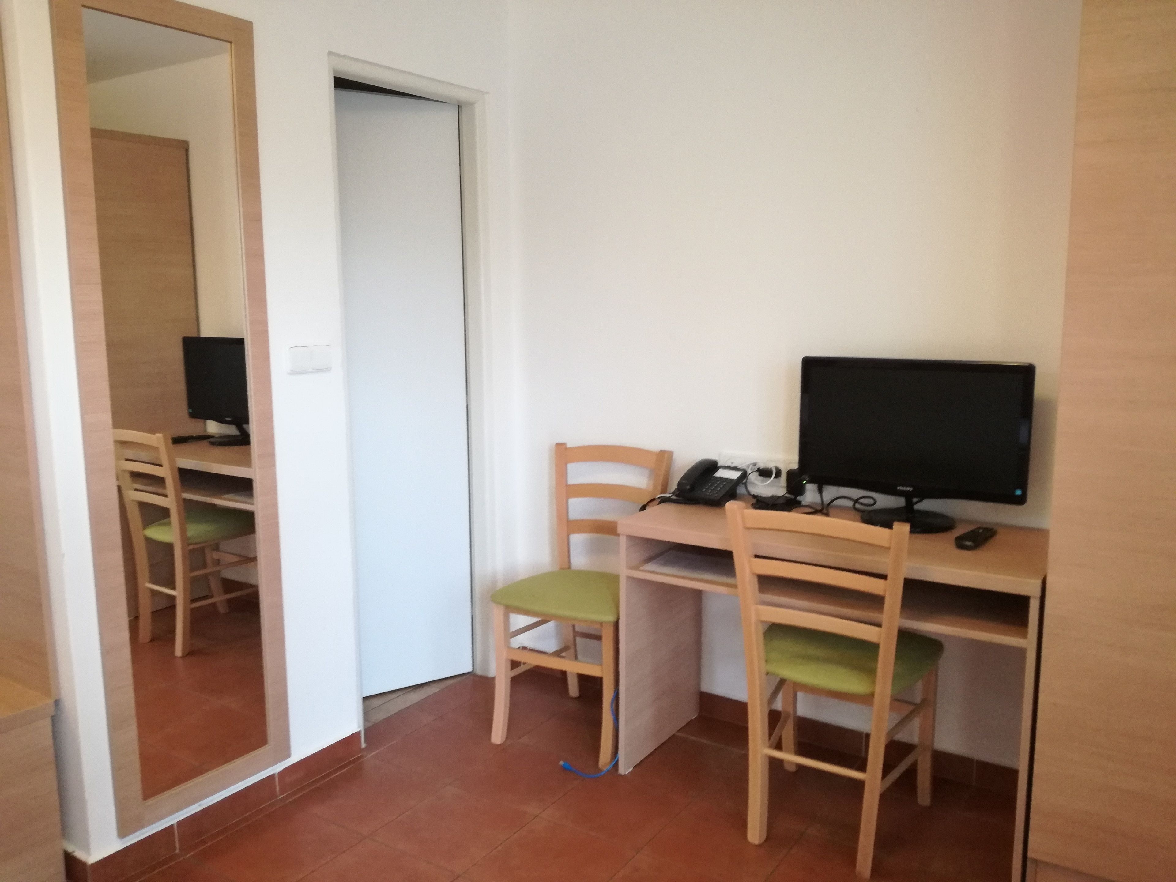 standard twin room | in-room safe, desk, blackout curtains, iron/ironing board