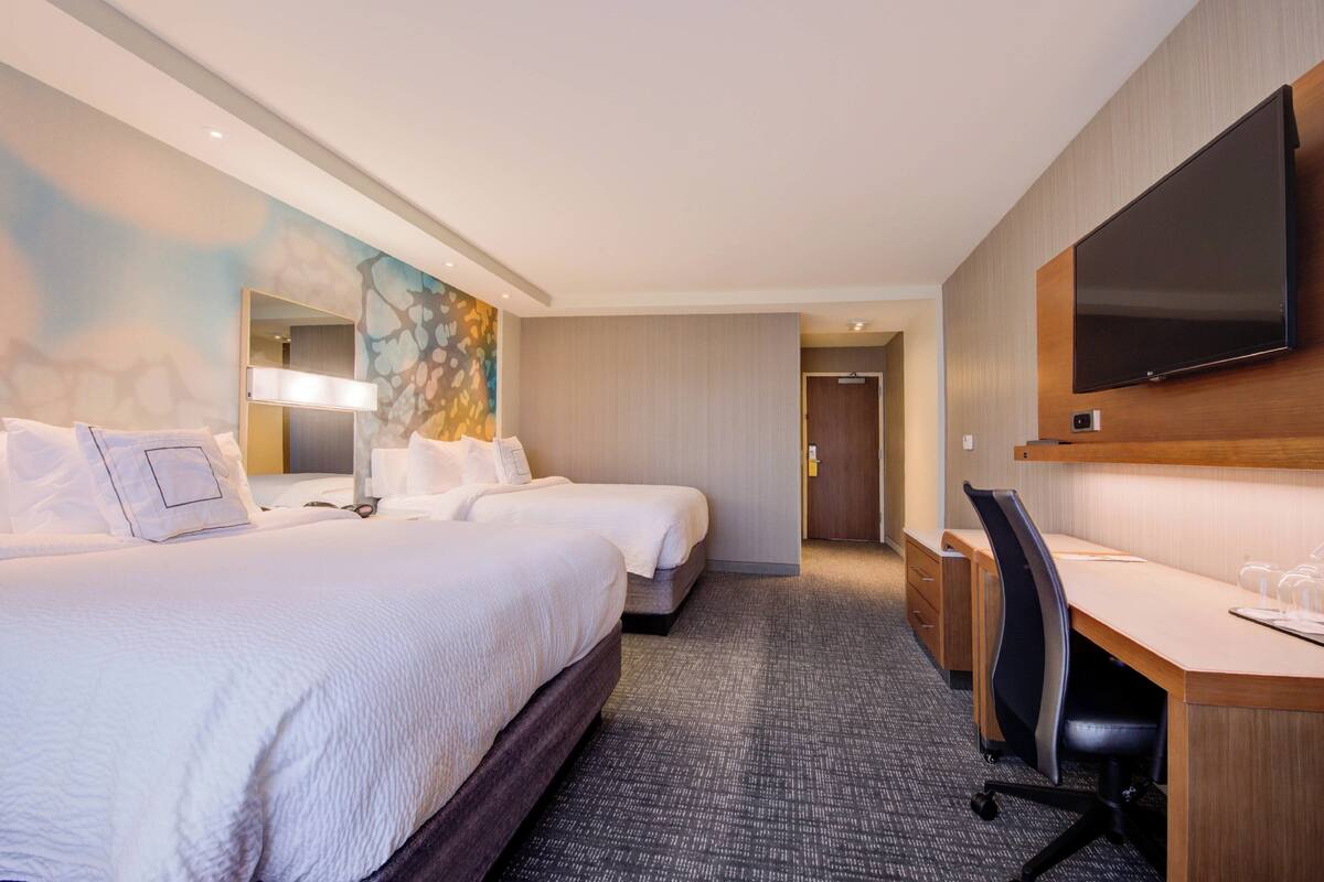 Premium bedding, pillowtop beds, desk, laptop workspace