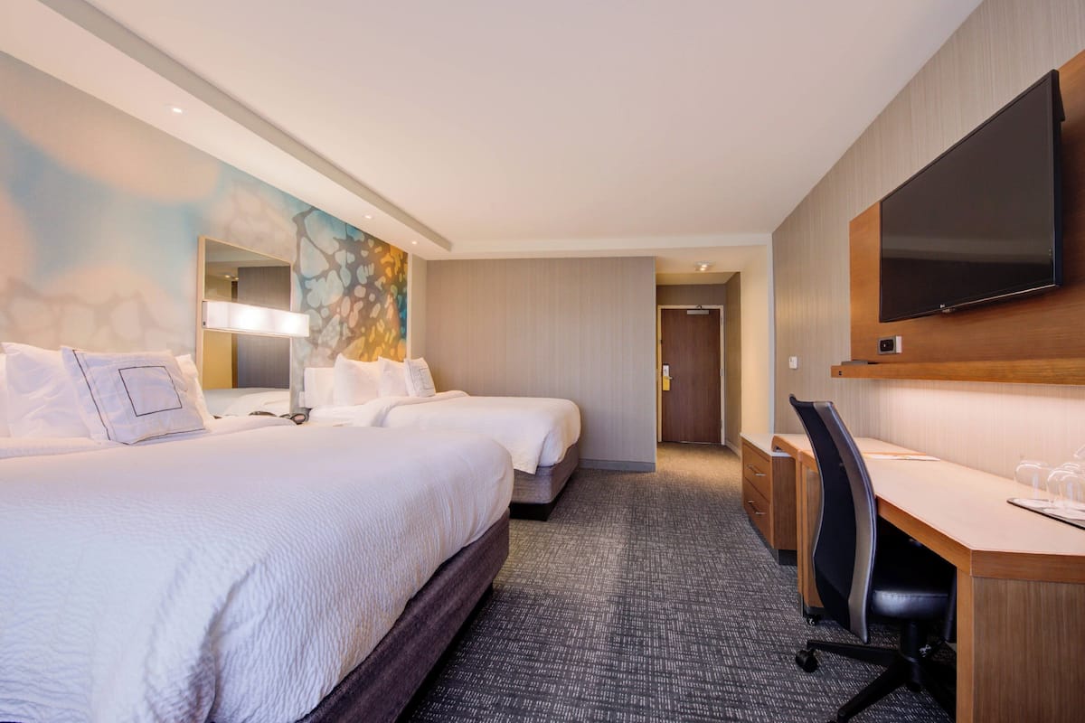 Premium bedding, pillowtop beds, desk, laptop workspace