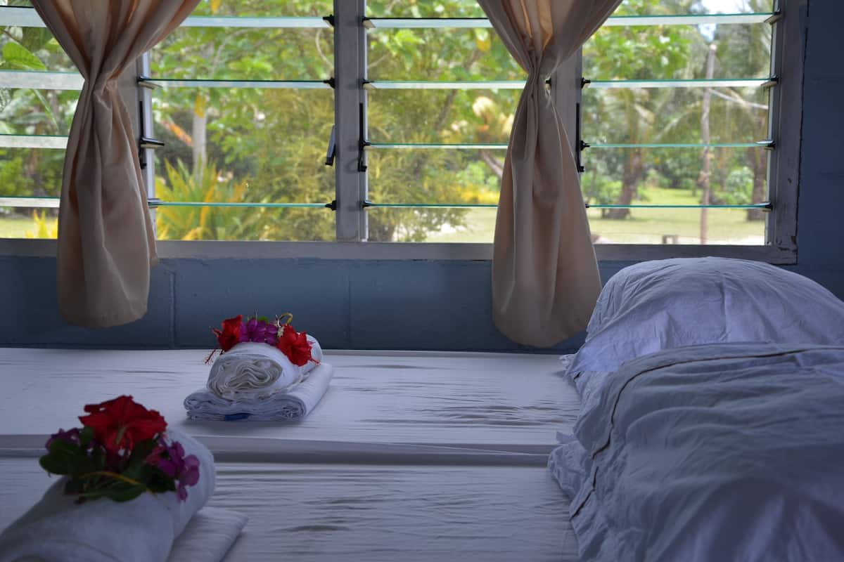 basic bungalow, 1 bedroom, shared bathroom, oceanfront | 1 bedroom, iron/ironing board, bed sheets