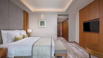 Premium bedding, down comforters, minibar, in-room safe