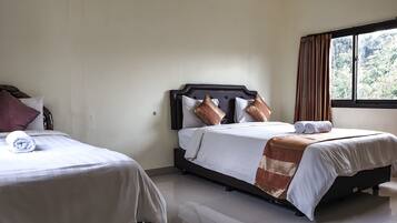 Standard Quadruple Room, Multiple Beds, Garden View | Down comforters, pillowtop beds, desk, blackout drapes