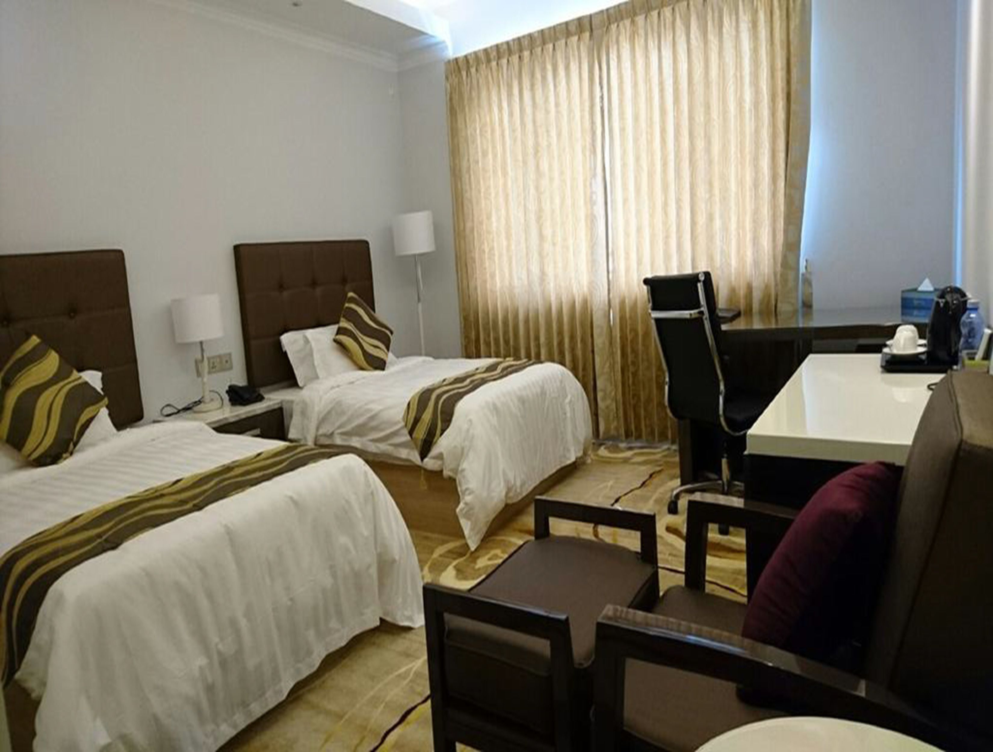 deluxe room | minibar, in-room safe, desk, blackout curtains