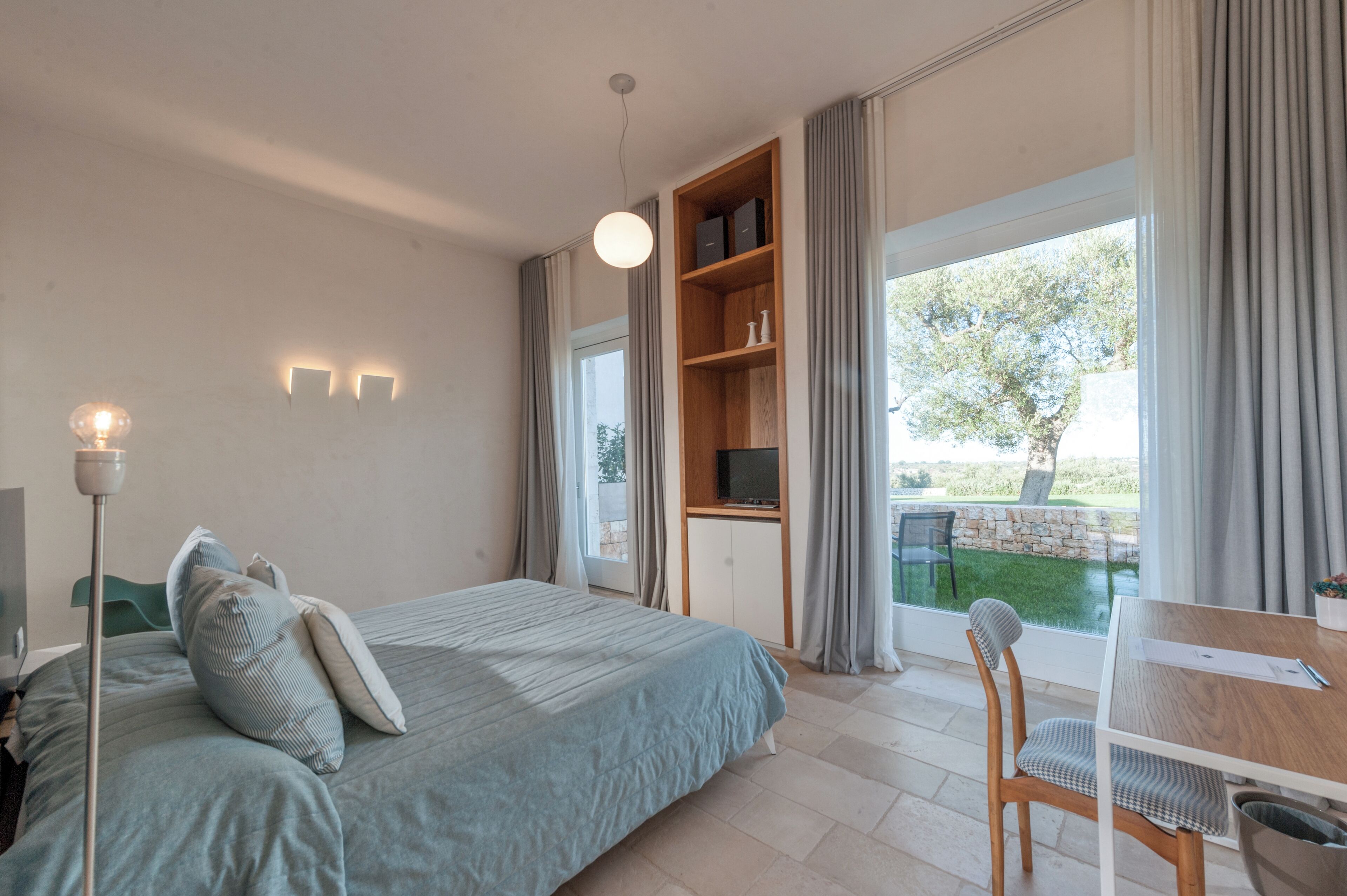 deluxe room, patio, garden area | 1 bedroom, premium bedding, minibar, in-room safe