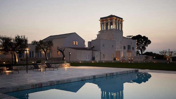 A large building with a pool, outdoor seating, and a bell tower. - Villa Torre Bianca by Emily Hotels (Polignano a Mare)