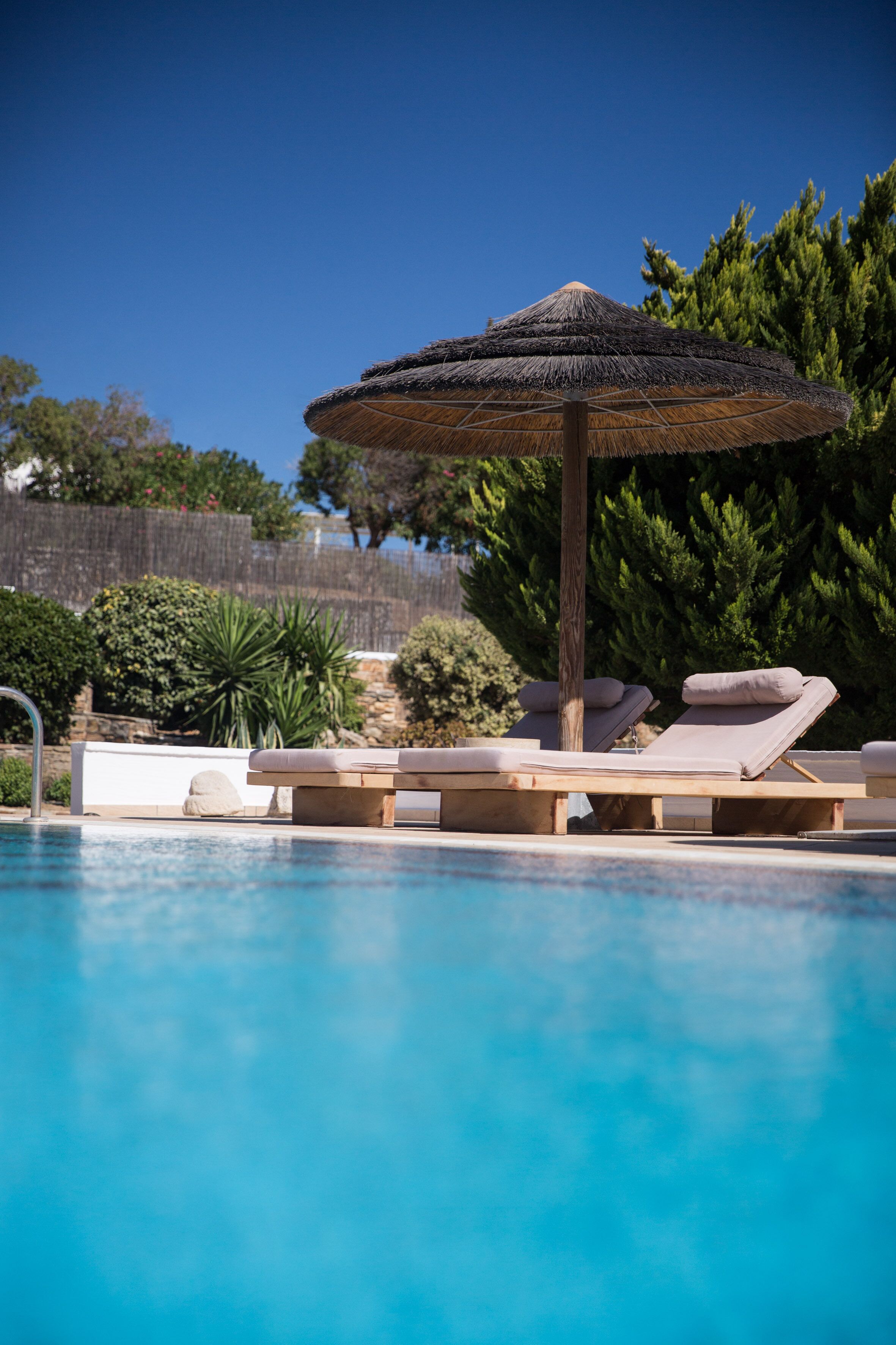 outdoor pool, pool umbrellas, pool loungers
