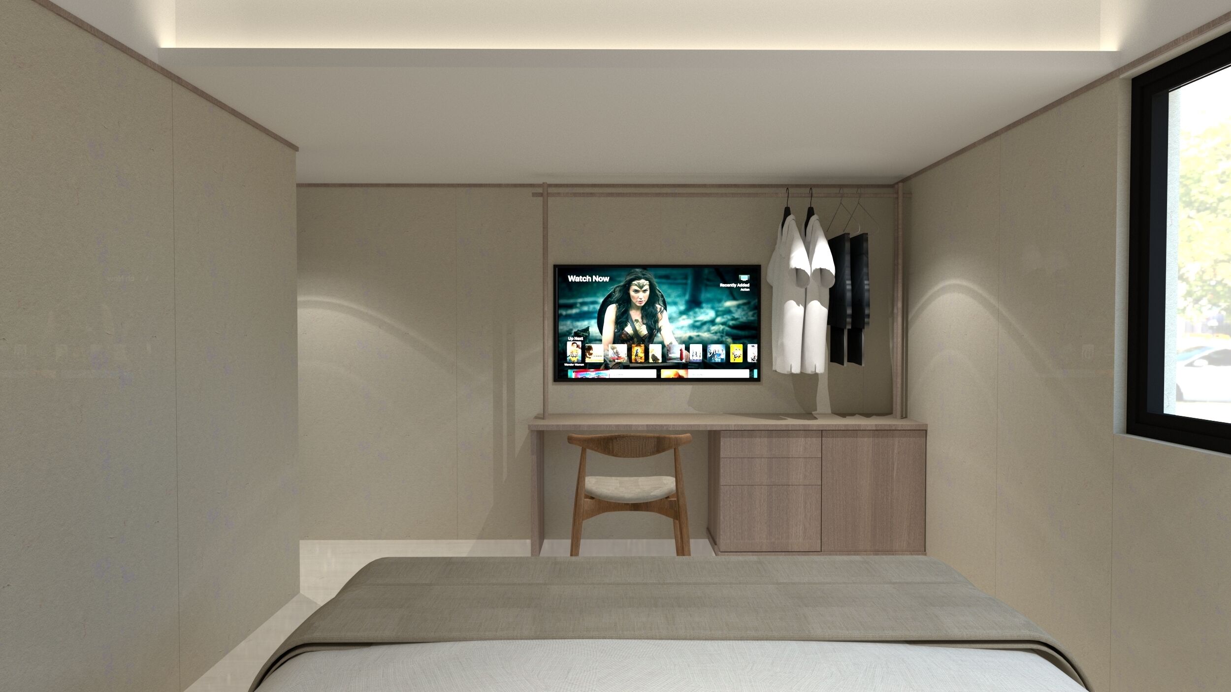 A modern bedroom with a bed, a desk, and a TV mounted on the wall.