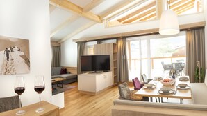 Een moderne woonkamer met een televisie, bank en een eethoek, klaar voor een maaltijd.