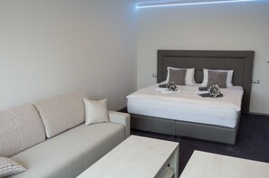 Deluxe Studio, Kitchenette (A - with Terrace) | Living area | TV - Villa Kiwi (Mikulov)