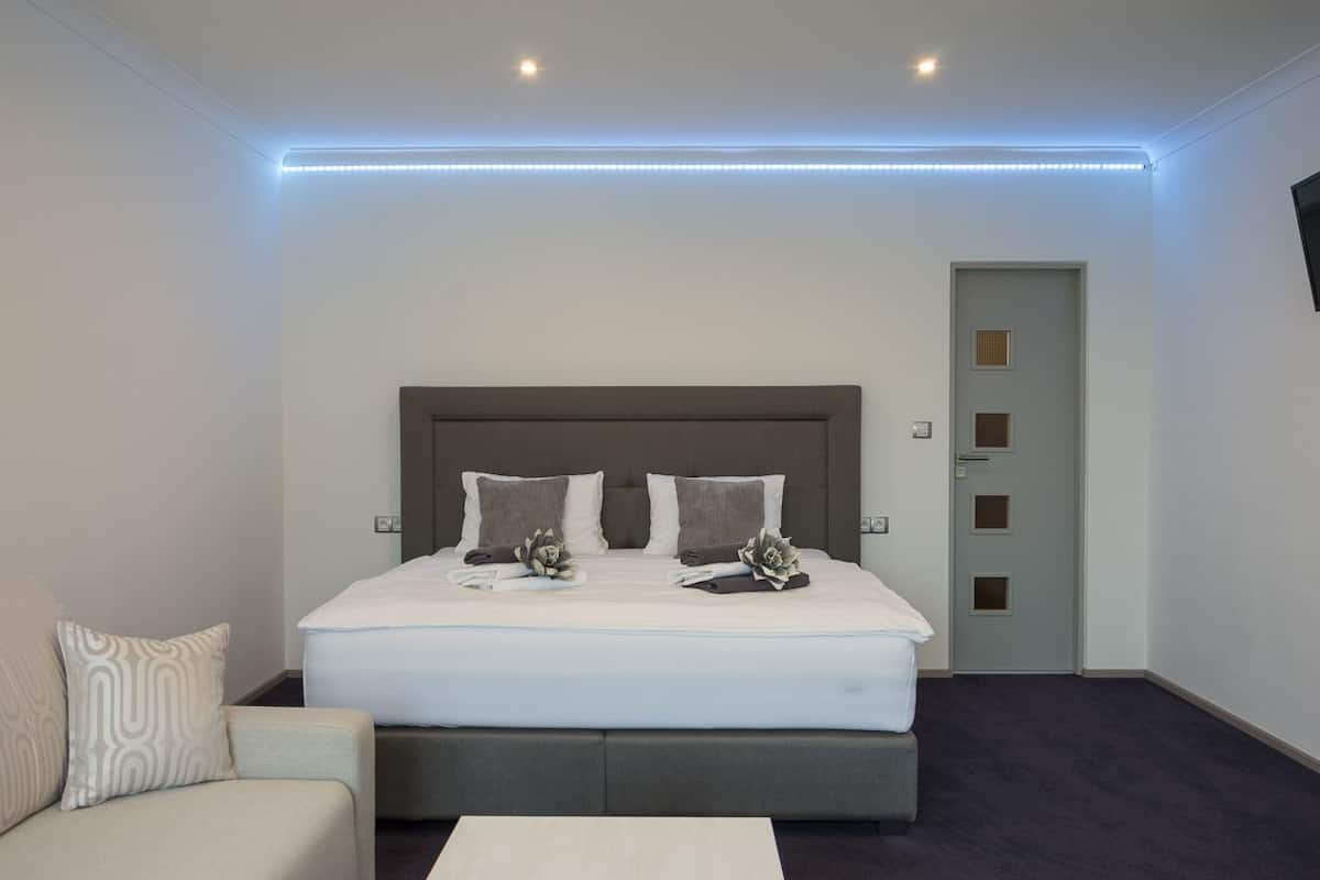 Deluxe Studio, Kitchenette (A - with Terrace) | Desk, soundproofing, iron/ironing board, free cribs/infant beds