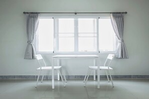 Deluxe Double Room | Living area | 32-inch flat-screen TV with digital channels, TV, offices