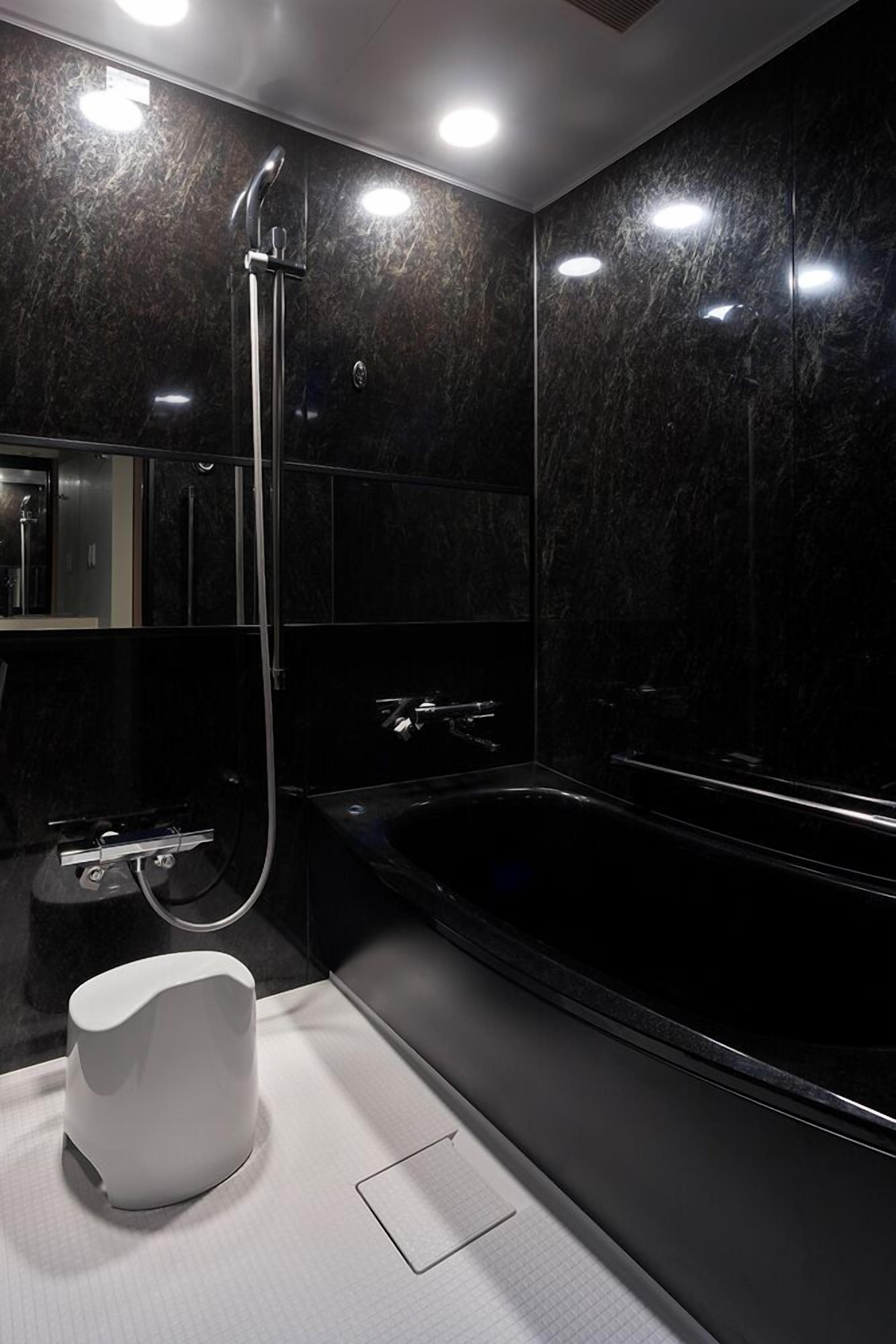 separate bathtub and shower, free toiletries, hair dryer, slippers