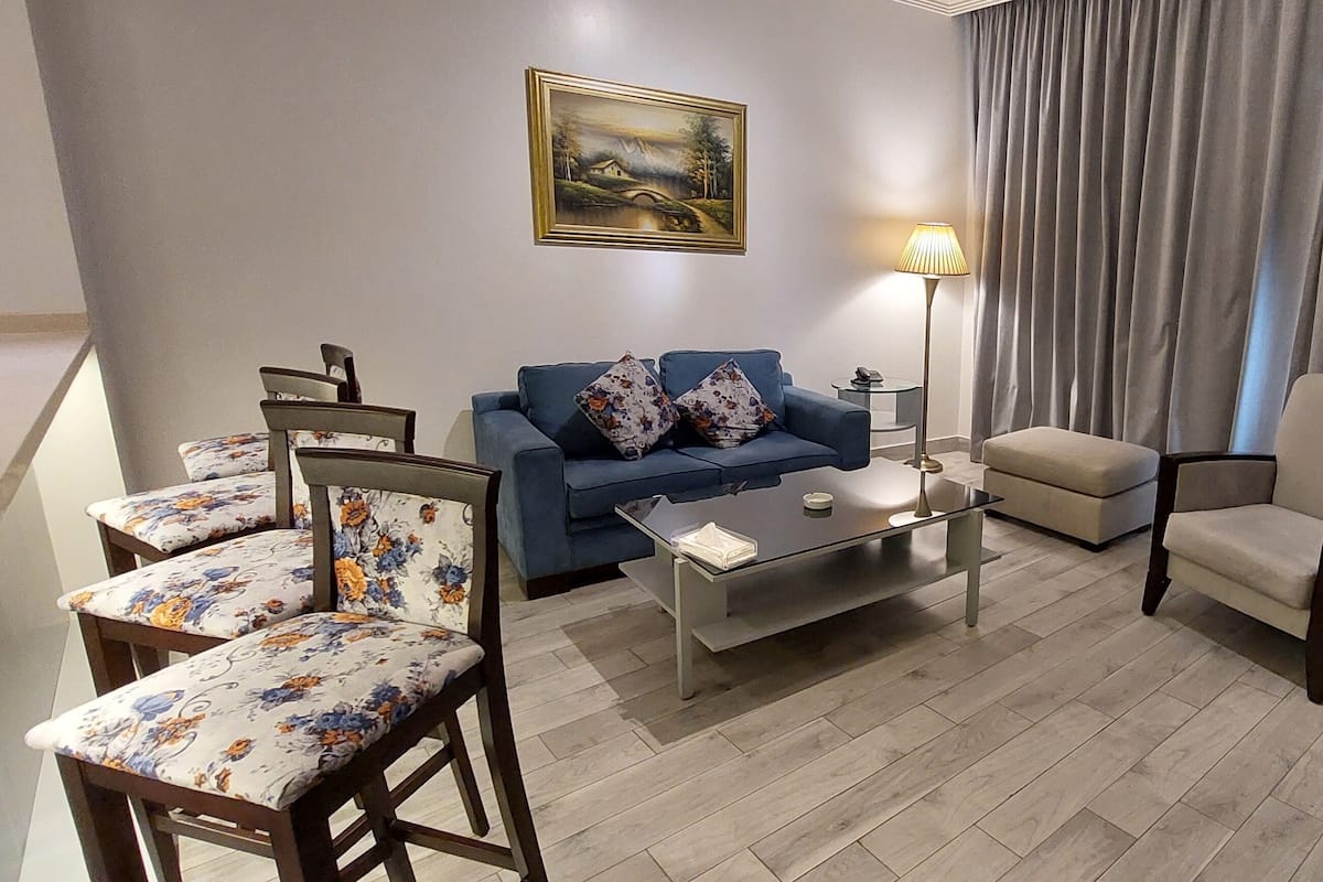 Premium Suite, 2 Bedrooms | Living area | 32-inch flat-screen TV with satellite channels, TV, DVD player