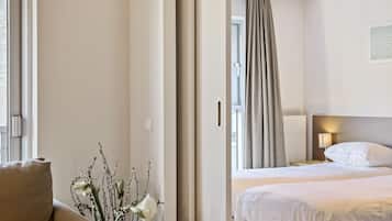 Junior Suite, 1 Bedroom | 1 bedroom, in-room safe, soundproofing, cribs/infant beds
