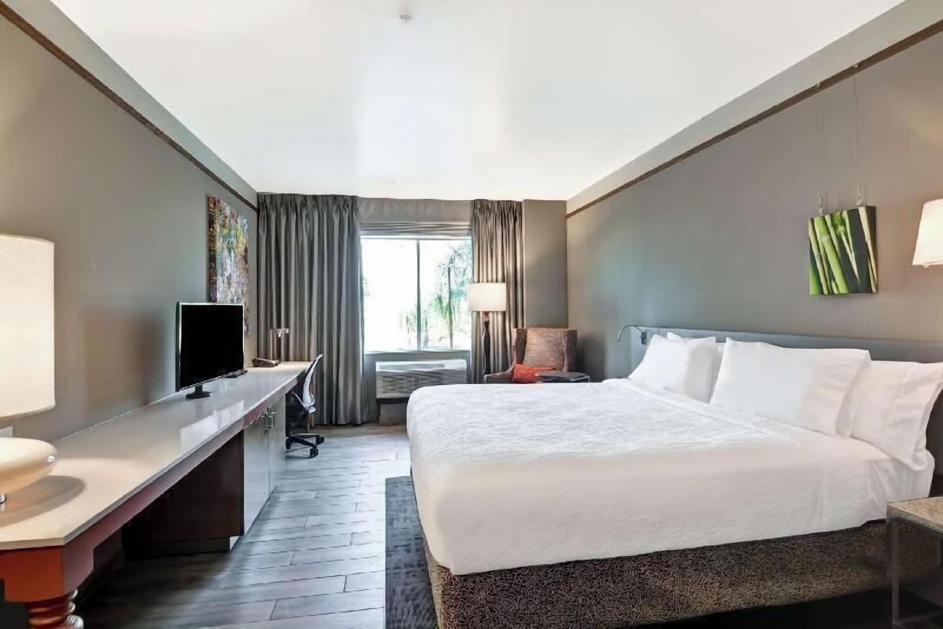 Premium bedding, desk, laptop workspace, iron/ironing board