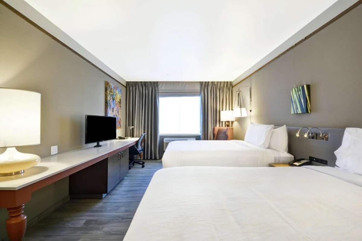 Premium bedding, desk, laptop workspace, iron/ironing board
